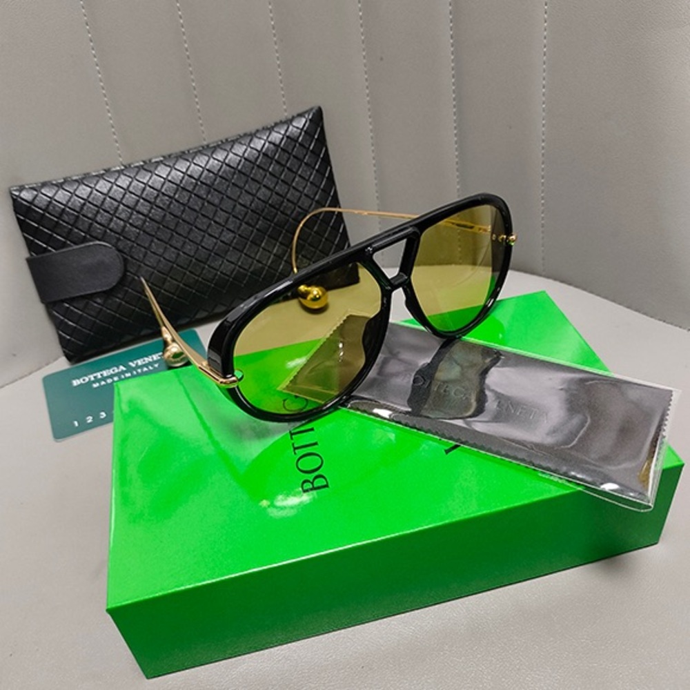 Bottega Veneta Black Frames with Gold Temples and Yellow Lenses Sunglasses